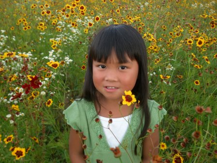 Kasen posing in field of flowers